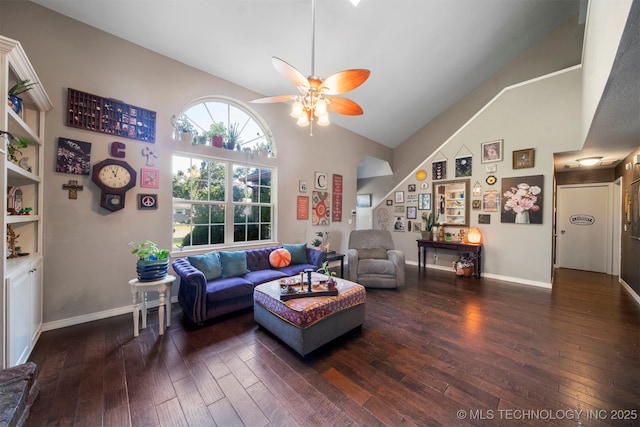 living room featuring ceiling fan, dark hardwood / wood-style floors, and high vaulted ceiling