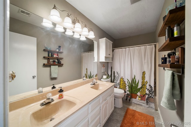 bathroom featuring toilet, a shower with curtain, a textured ceiling, vanity, and tile patterned flooring