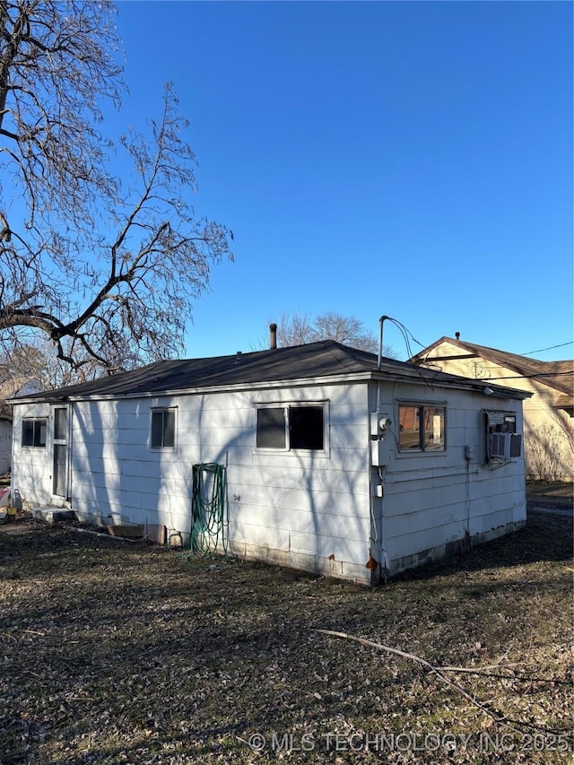 back of house with cooling unit