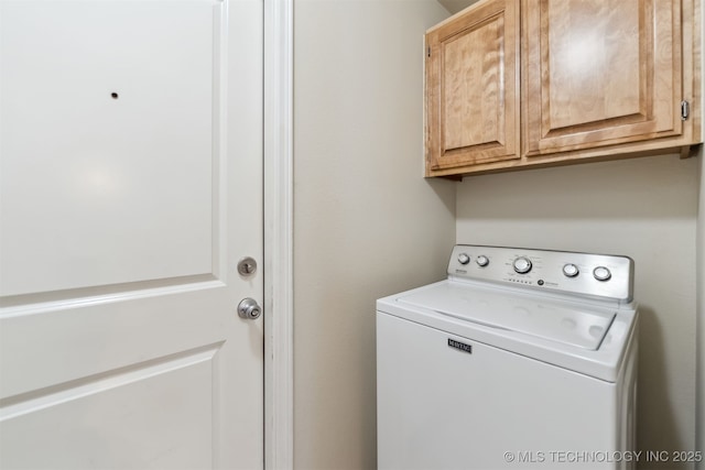 laundry room featuring washer / clothes dryer and cabinets