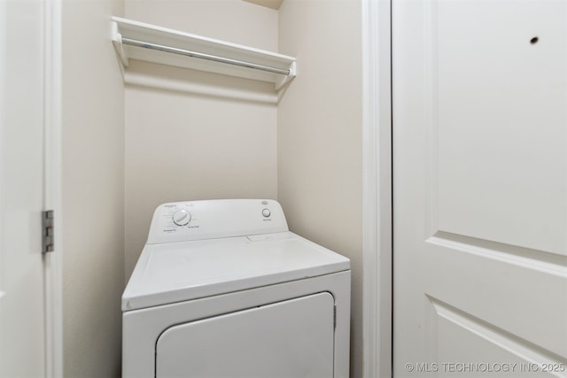 laundry room with washer / dryer