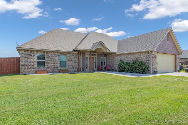 view of front of house with a garage and a front yard