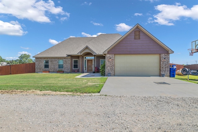 craftsman inspired home featuring a garage and a front lawn