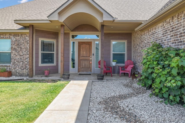 property entrance with a yard