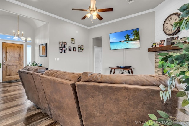 living room featuring hardwood / wood-style flooring, crown molding, and ceiling fan with notable chandelier