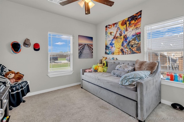 living room featuring ceiling fan and light carpet