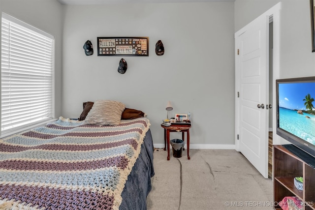 bedroom featuring light colored carpet