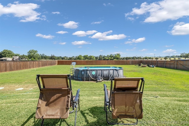 view of yard featuring a fenced in pool