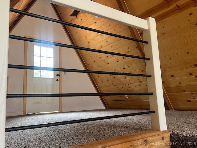 interior space featuring wooden walls and vaulted ceiling