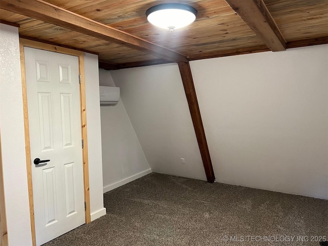 basement with a wall mounted air conditioner, dark carpet, and wooden ceiling