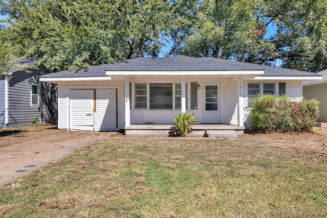 single story home featuring a front lawn and covered porch