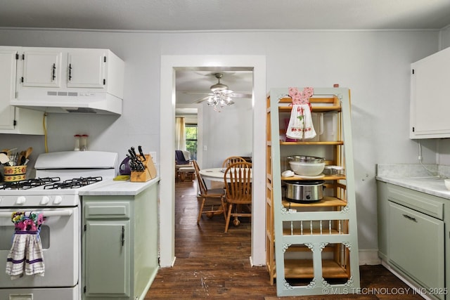 kitchen featuring dark hardwood / wood-style floors, white cabinetry, green cabinets, ceiling fan, and white gas range oven