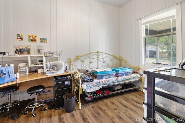 bedroom with wood-type flooring