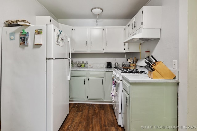 kitchen with white appliances, dark wood-type flooring, and white cabinets