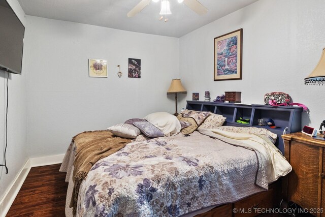 bedroom featuring dark wood-type flooring and ceiling fan