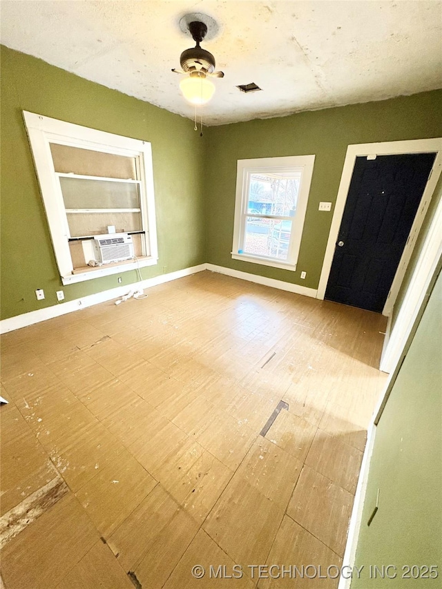 entrance foyer with cooling unit and ceiling fan