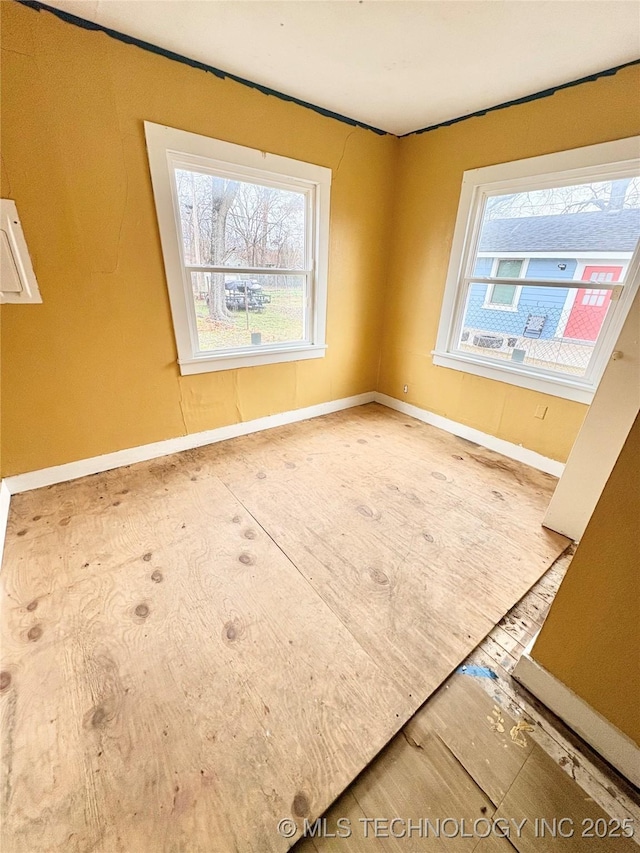 spare room featuring plenty of natural light