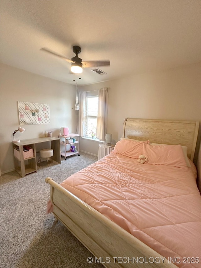 carpeted bedroom featuring ceiling fan and radiator heating unit