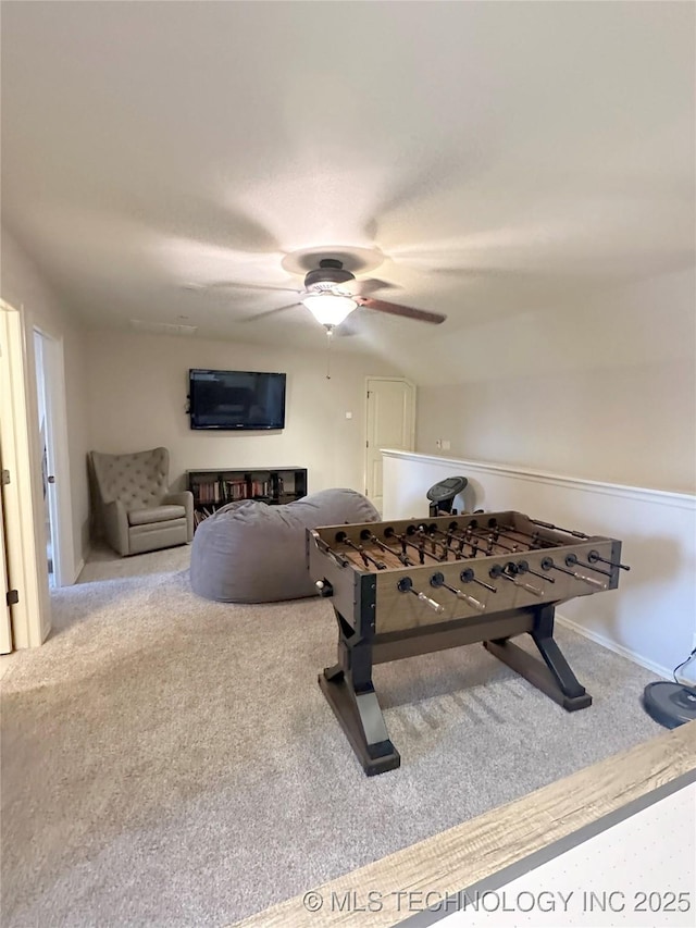 game room with ceiling fan and carpet