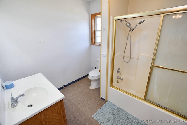 full bathroom featuring vanity, shower / bath combination with glass door, and toilet