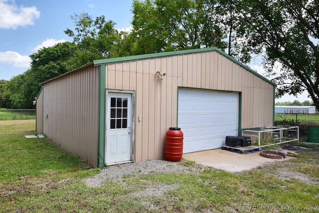 garage featuring a lawn