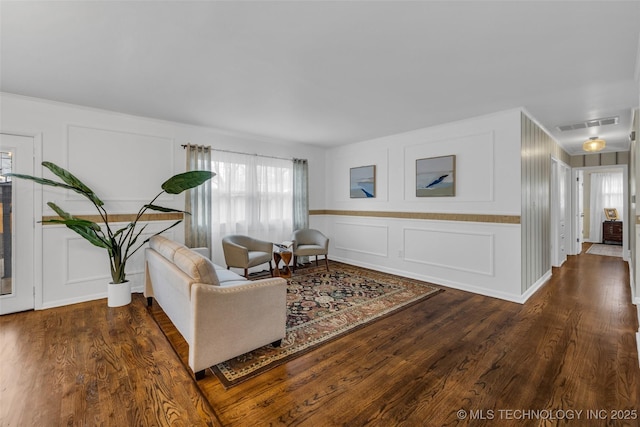 living room with dark hardwood / wood-style flooring