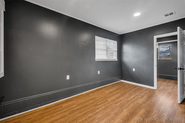 empty room with hardwood / wood-style floors