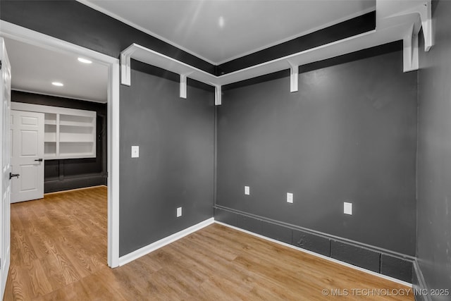 walk in closet featuring light hardwood / wood-style flooring