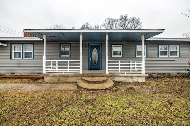 view of front of property with a porch and a front lawn