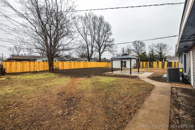 view of yard featuring a gazebo, a patio area, and central air condition unit