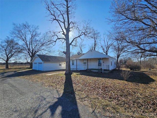 view of front of property featuring a garage and covered porch