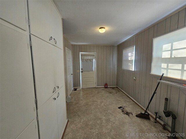 clothes washing area featuring ornamental molding