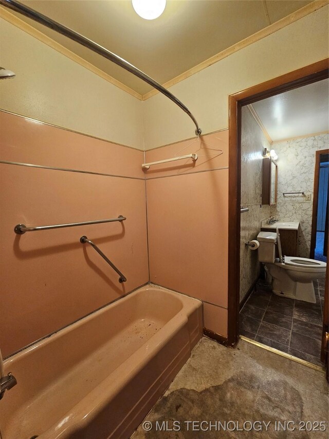 full bathroom featuring vanity, ornamental molding, toilet, and bathtub / shower combination