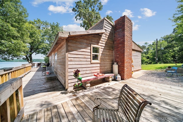 wooden deck featuring a water view