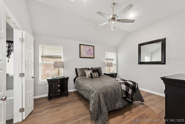 bedroom featuring ceiling fan, dark hardwood / wood-style flooring, and vaulted ceiling