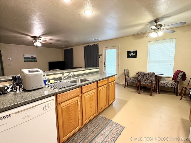 kitchen with ceiling fan, sink, a textured ceiling, and white dishwasher