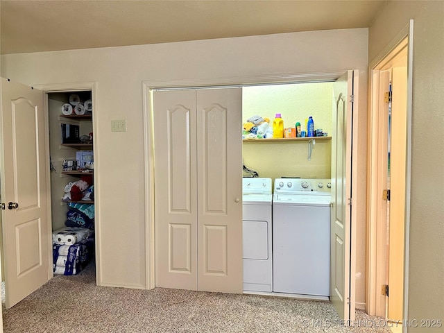 clothes washing area with carpet flooring and washing machine and dryer