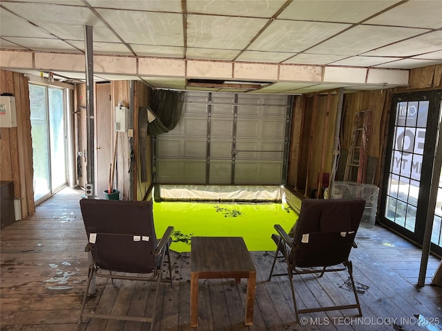 garage featuring wooden walls