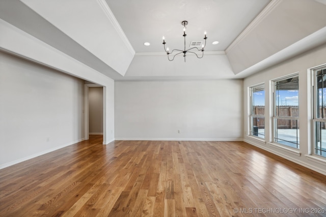 interior space featuring crown molding, an inviting chandelier, and hardwood / wood-style floors