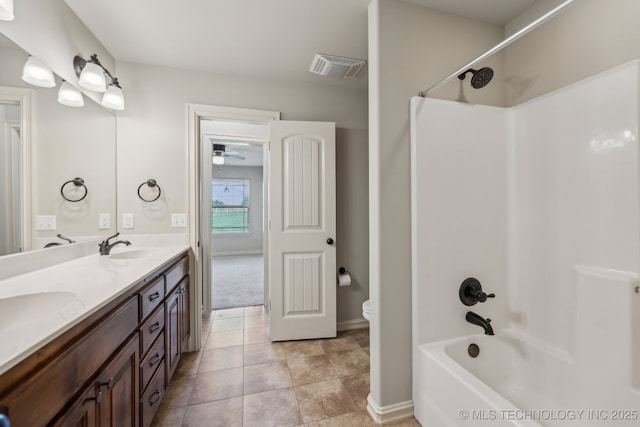 full bathroom with vanity, shower / tub combination, tile patterned floors, and toilet