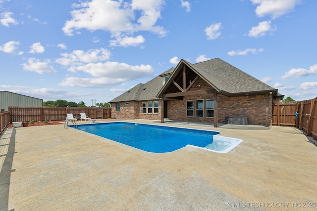 view of swimming pool featuring a patio