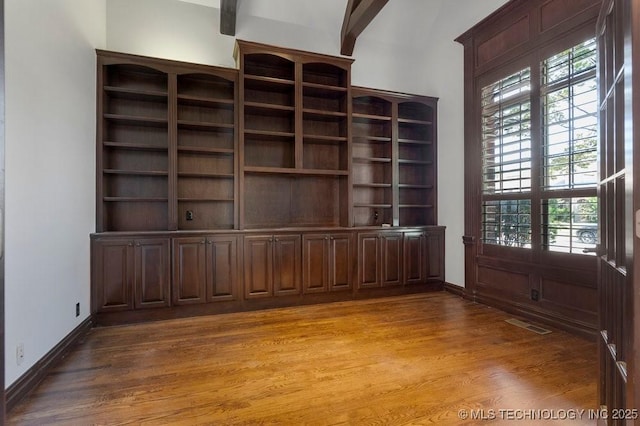 unfurnished living room featuring wood-type flooring