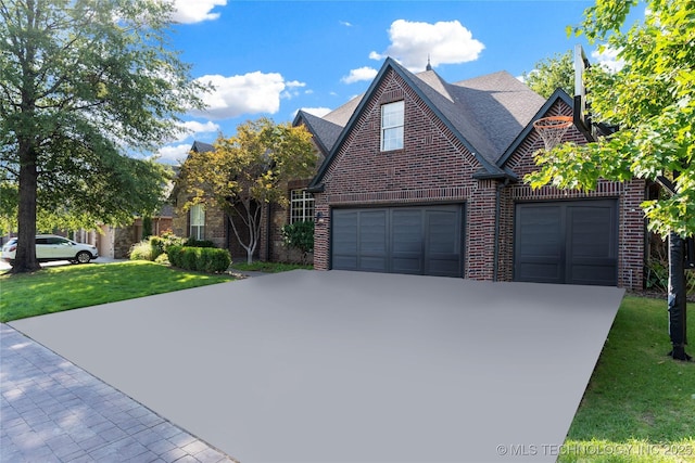 view of front of property with a garage and a front yard