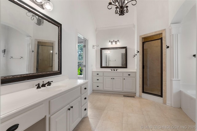 bathroom with vanity, crown molding, and plus walk in shower