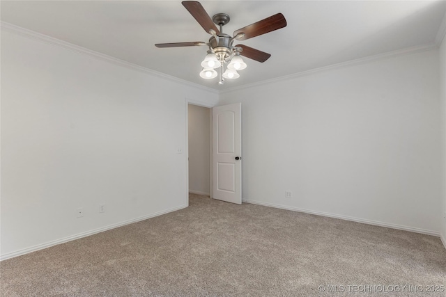 spare room with ceiling fan, ornamental molding, and light carpet