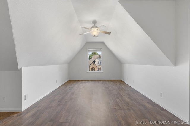 bonus room featuring dark wood-type flooring, ceiling fan, and vaulted ceiling