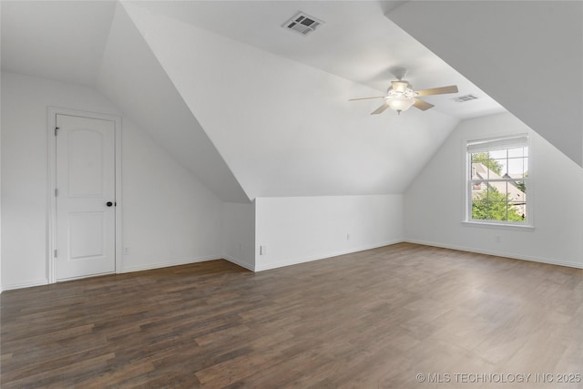 additional living space with dark wood-type flooring, ceiling fan, and vaulted ceiling