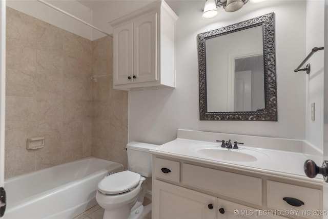 full bathroom featuring vanity, tile patterned flooring, tiled shower / bath combo, and toilet