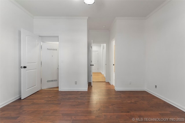 unfurnished bedroom with crown molding and dark wood-type flooring