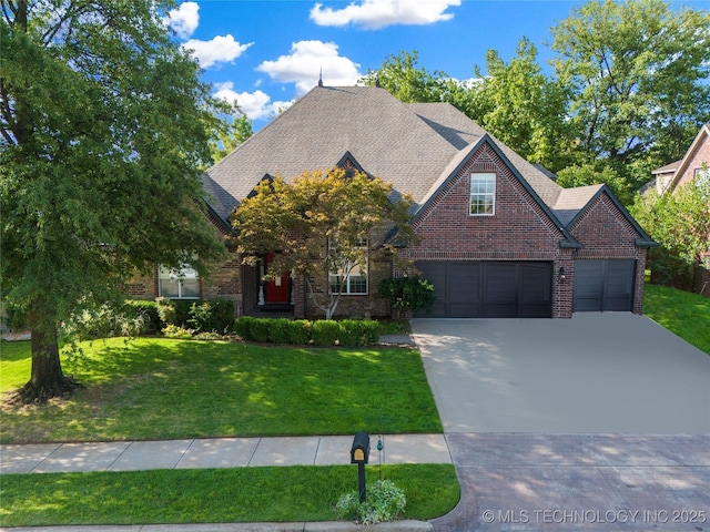 view of front of property with a garage and a front yard